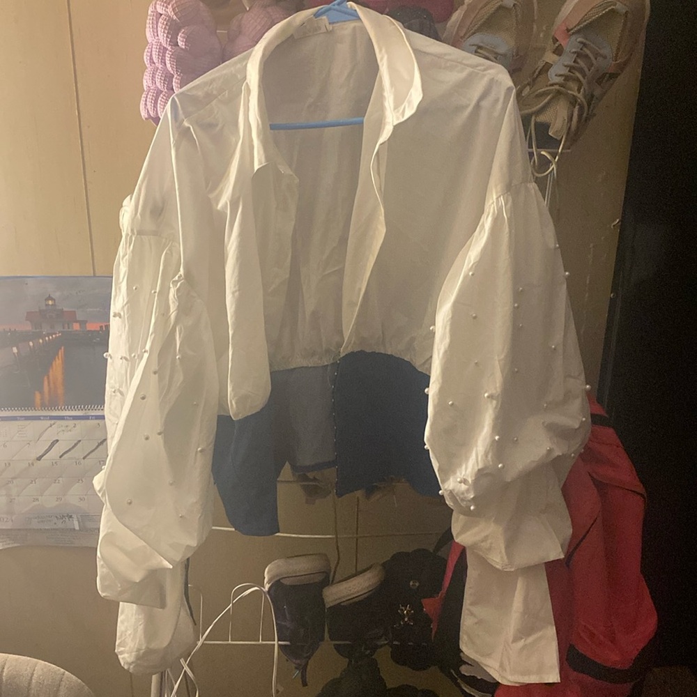 A white pearl shirt, has pearls on it , from WoWo ,  a 3XL worn once